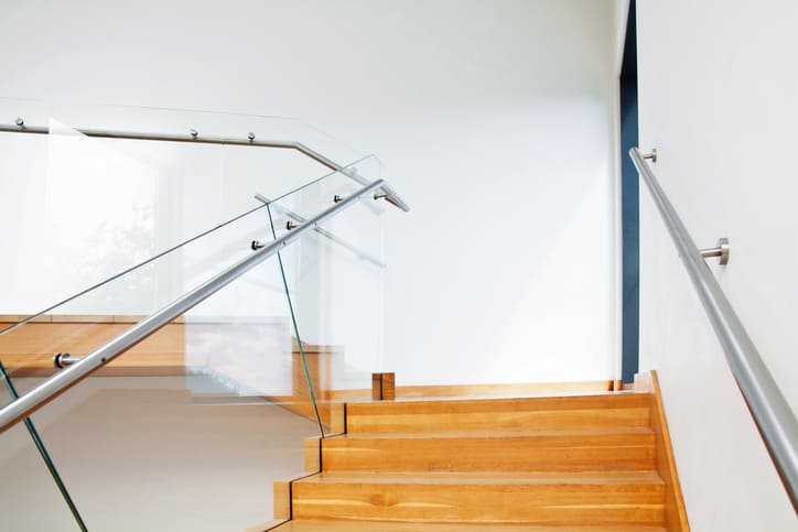 Sleek glass railing with stainless steel fittings in  Etobicoke property