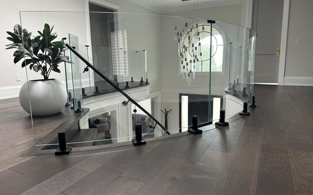 Modern curved glass railings on staircase
